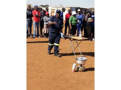 In his fire demonstration, DEMS shift manager Thami Mkhwanazi demonstrated how to fight fires, simple ways to handle candles, and building shacks three meters apart to avoid fire spreading from one shack to the next.