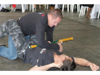 Carlo Stickling demonstrating how swift action, when under assault when still in one's vehicle, can be neutralised through taking the right action. His "attacker" is Coen Stickling.