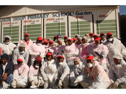 As their way of giving back to the communities, this group of Colgate employees spend their time on Mandela Day cleaning and painting the Goedehoop PrimarySchool classrooms.