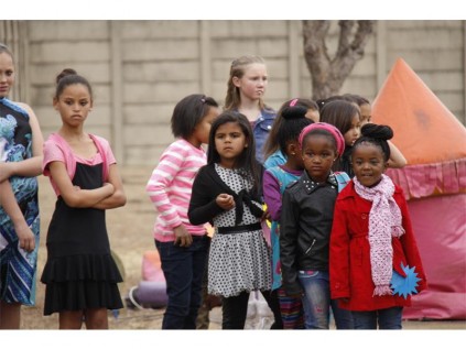Little girls line up to register for the beauty pageant show where Little Miss Parkdene was crowned.