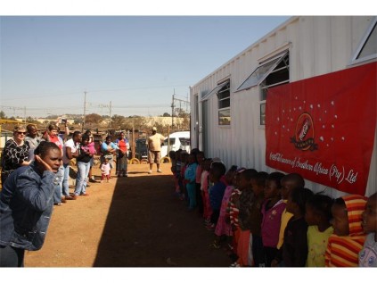 Children of the school sang and danced for the visitors during the handover of the container classroom.