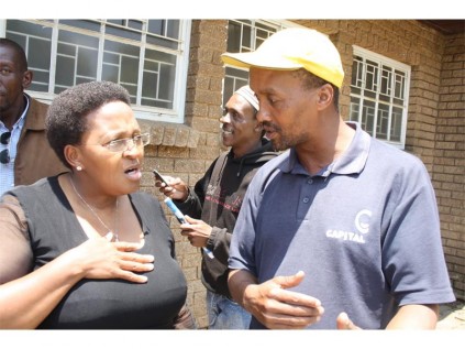 Gauteng Social Development MEC Faith Mazibuko and Elroy Petersen, father of Cuburne van Wyk,, who was recently killed in Reiger Park.
