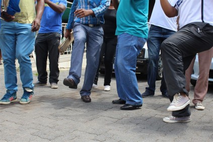 A group of police members toy- toying in the boardroom of the station, both demanding that, Govender be removed immediately.