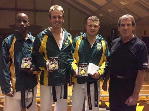 Christopher Anthony (third from left) with his South African teammates, Moses Sebopa, Coenraad Malan and instructor Malcolm Dorfling. The team defeated Japan in the senior male team kumite final to win gold at the KWF World Cup.