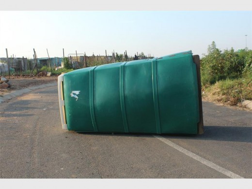 Demonstrators upended the unfashionable communal bucket toilets in the informal settlement.