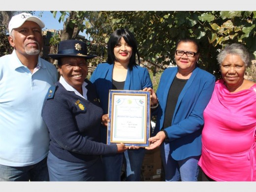 Reiger Park SAPS station commander Col Elsie Mashinini is seen handing over the certificate of appreciation to Maranatha Funeral Directors' Luzaan Julius and Gilda Swartz, while CPF's Sam Malgas (left) and Pastor Francis Coetzee (right) look on.