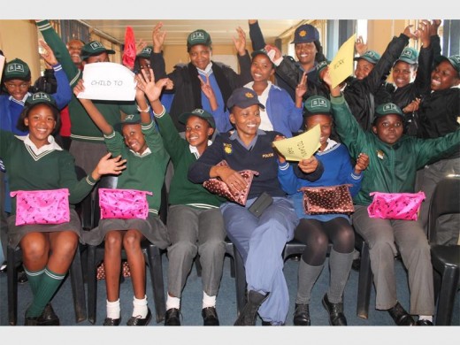 Excited Dawn Park Police Station police officers and learners from Villa Liza Primary School, Thulasizwe Primary School and Windmill Park Primary School during the day.
