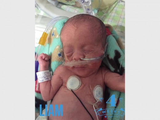 Liam (triplet two) at four weeks. Although the boys are identical, mother Ronelle said Liam has a longer and chubbier face than Mason.