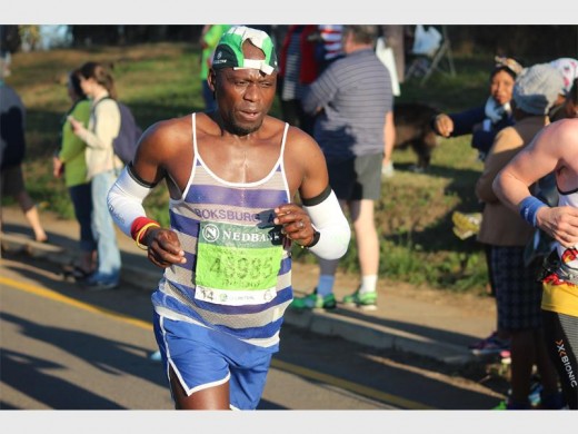 Richard Ngwenya finished in 10:03:38 in his 15th Comrades finish. He earned a bronze medal. Photographer: Logan Green.