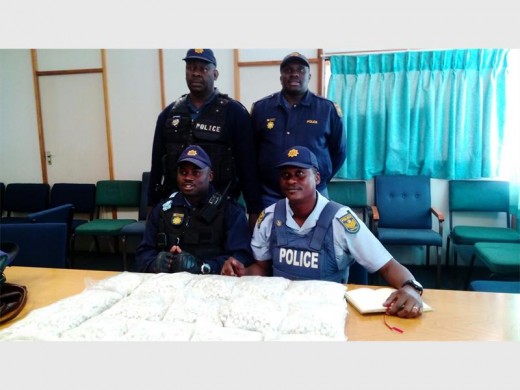 Seen here are the arresting officials back (from left) WO Kgantsi and Const Masibi. Front: Const Tshilwavhusiku and Sgt Mathebula.