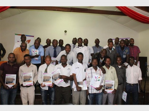 Seen with their certificates, during the graduation ceremony, are some of the taxi operators who took part in the training on customer service.