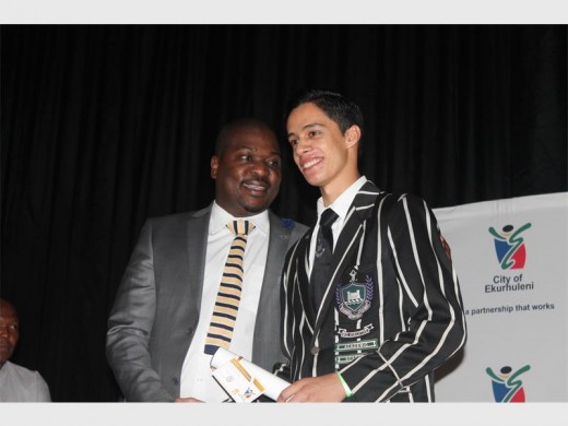 MMC Doctor Xhakaza congratulating Boksburg High School learner Salmaan Ghole (best performing learner overall).