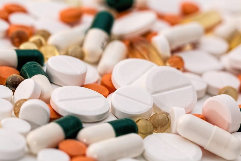 Image of pills and capsules of various sizes and colours