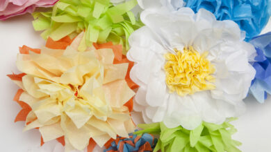 Help your child make tissue paper pom pom flowers