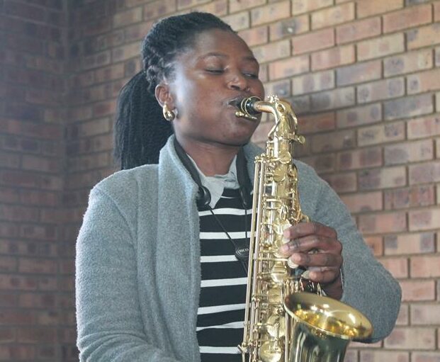 A jubilant atmosphere filled the hall as community members sang happy birthday songs and danced.