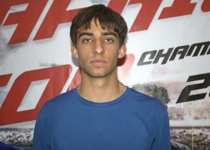 He won the singles, doubles and mixed doubles titles.