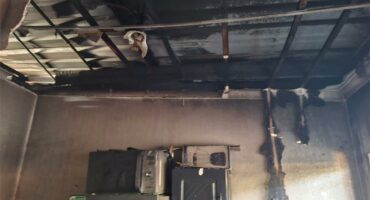 The property owners are assessing the damage and destruction left behind by fire at the block of apartments.