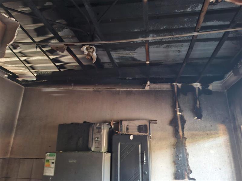 The property owners are assessing the damage and destruction left behind by fire at the block of apartments.