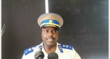 mugshot of Julius mkhwanani in full police uniform