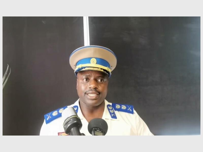 mugshot of Julius mkhwanani in full police uniform