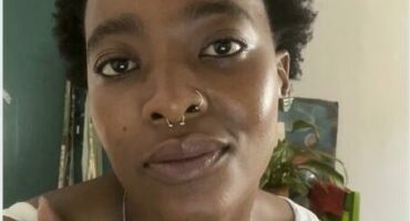 Photo of an African woman in short hair.