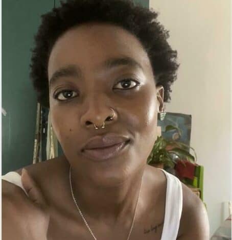 Photo of an African woman in short hair.