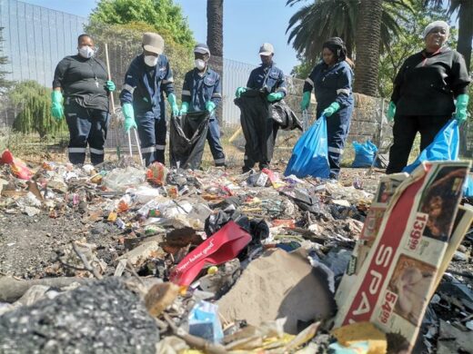 Philip Morris South Africa workers tackle the problematic waste sites next to the Boksburg Lake.