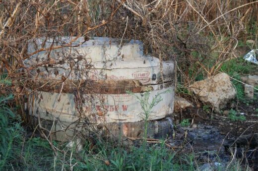 Leaky sewer drain system hidden in overgrown vegetation