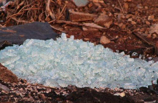 Illegally dumped glass waste and rubble waste