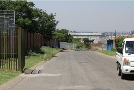 A white bakkie on Solomon road and access control gate