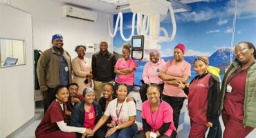 Tambo Memorial Hospital healthcare team posing in front of the newly installed digital X-ray system.