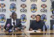 Ekurhuleni Mayor Doctor Xhakaza and Ekurhuleni city manager Kagiso Lerutla in the Mayor’s Parlour, with a white banner bearing the G20 and city of ekurhuleni logos in the background.