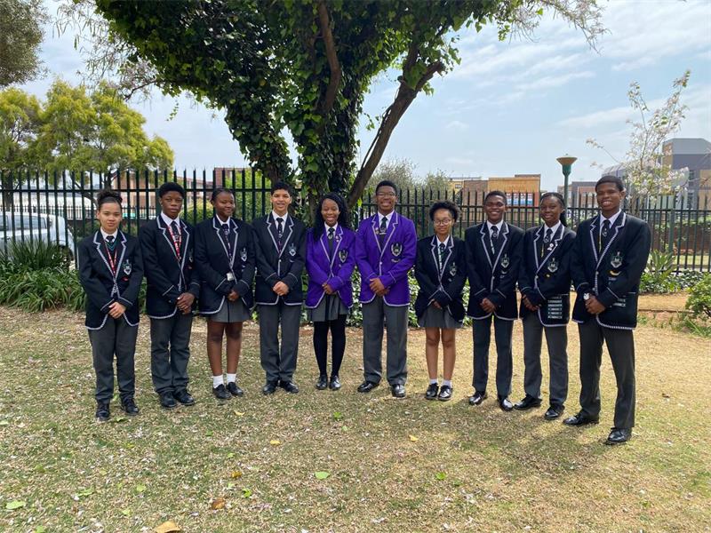 School learners, standing for a picture.