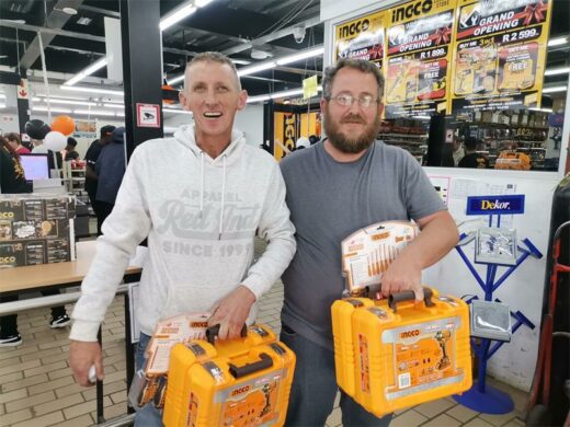 two white men holding brand-new Ingco power tools inside a newly opened shop in boksburgpower tools.
