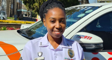 Black woman in her uniform.
