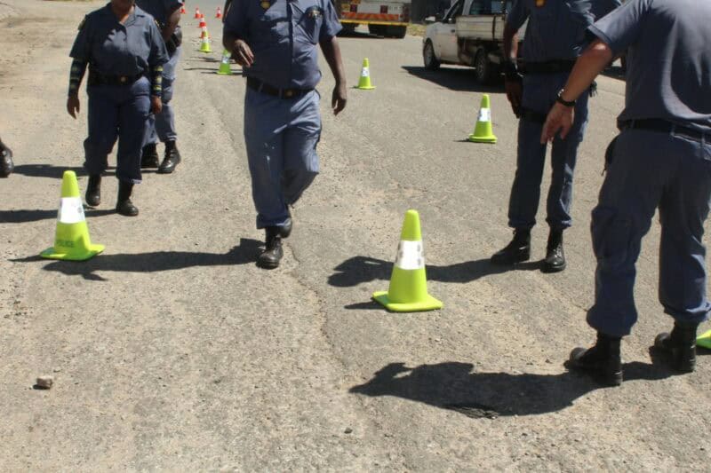 Police officers at a roadblock.