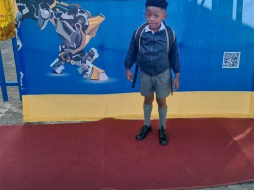A school child in school uniform.