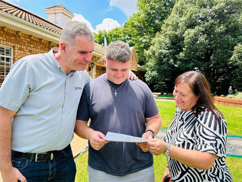 Parents, mother and father, check their son's NSC results