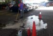 A staff member scrubs the forecourt of the Dalview petrol station