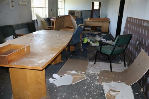 A ransacked office with its contents left lying upside down
