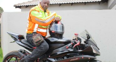 A black man dressed in his gear.