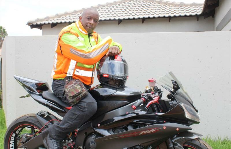 A black man dressed in his gear.