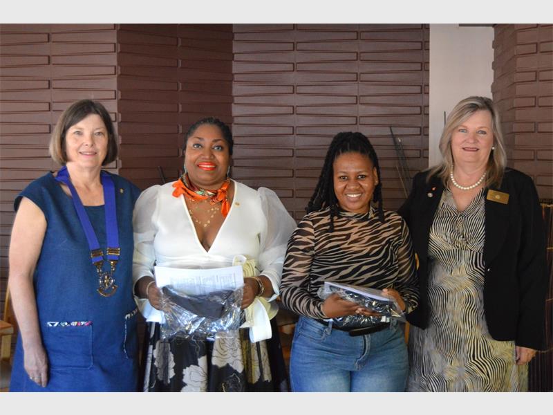 Four women, two white and two black.