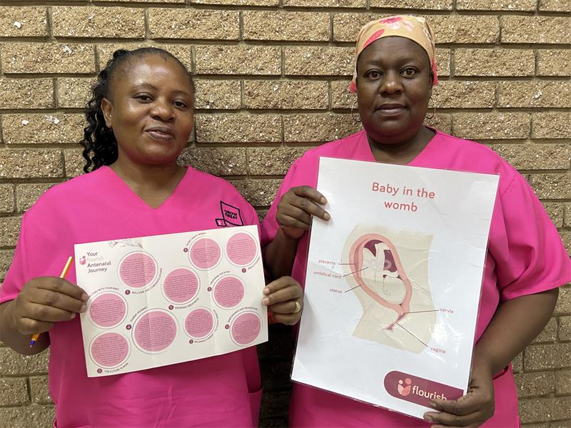 Black women dressed in pink srubs.