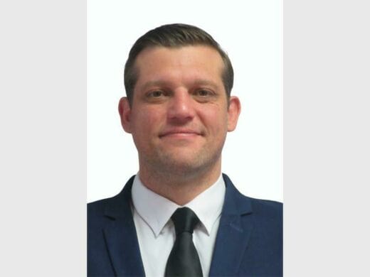 a man wearing a tie with a suit
