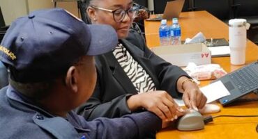 a police officer and an official from a private forensic company.