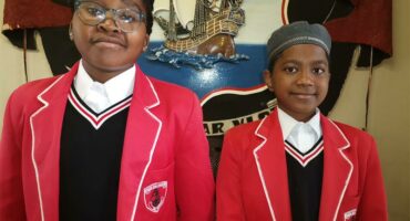 Two school children in their school uniform