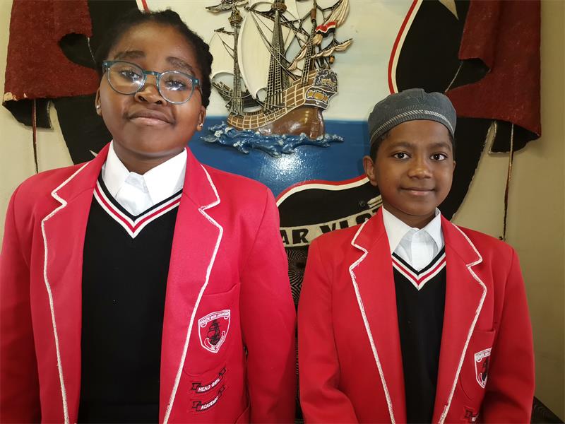 Two school children in their school uniform