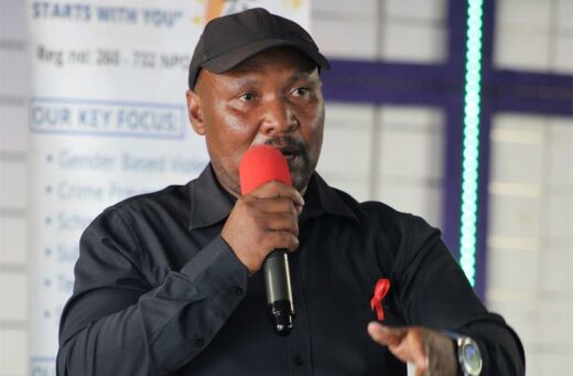 A black man addressing a crowd