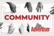 A black and white image of hands reaching into the red word Community and the boksburg Advertiser logo.